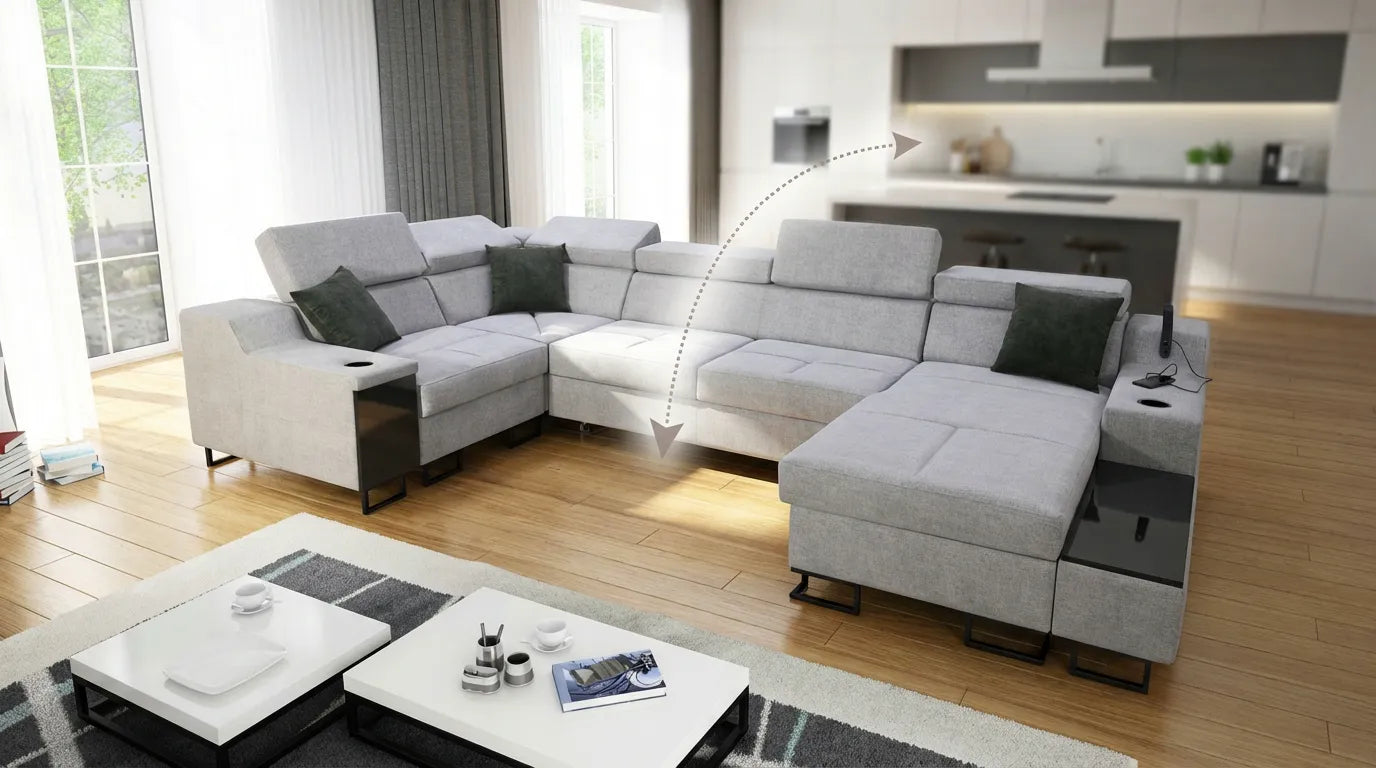 Canapé moderne dans un salon ouvert, illustrant la séparation visuelle entre le salon et la cuisine.