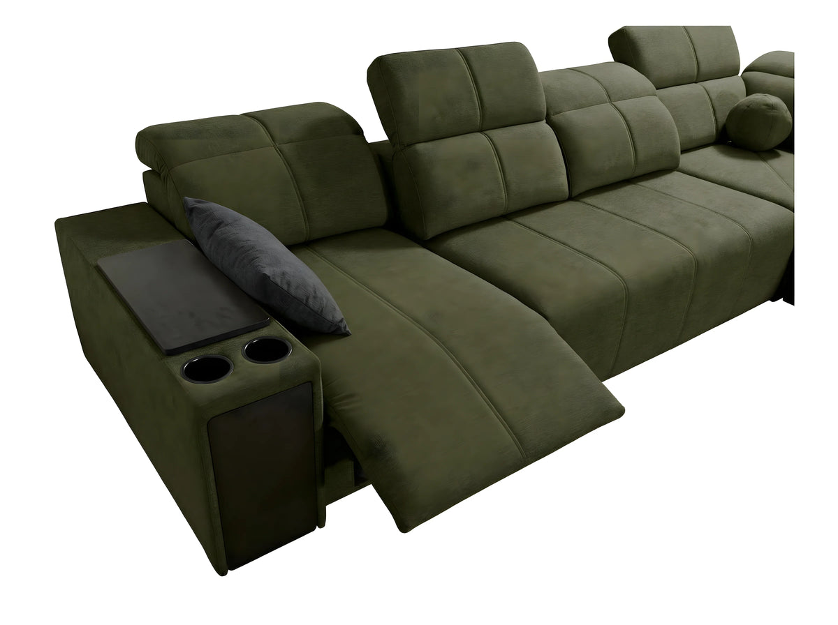 Canapé d'angle vert en velours, avec accoudoirs, porte-gobelets et coussin gris. Idéal salon moderne.