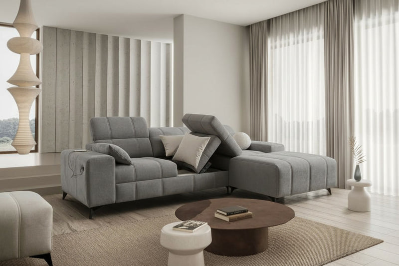 Image d'un canapé de couleur grise, convertible.