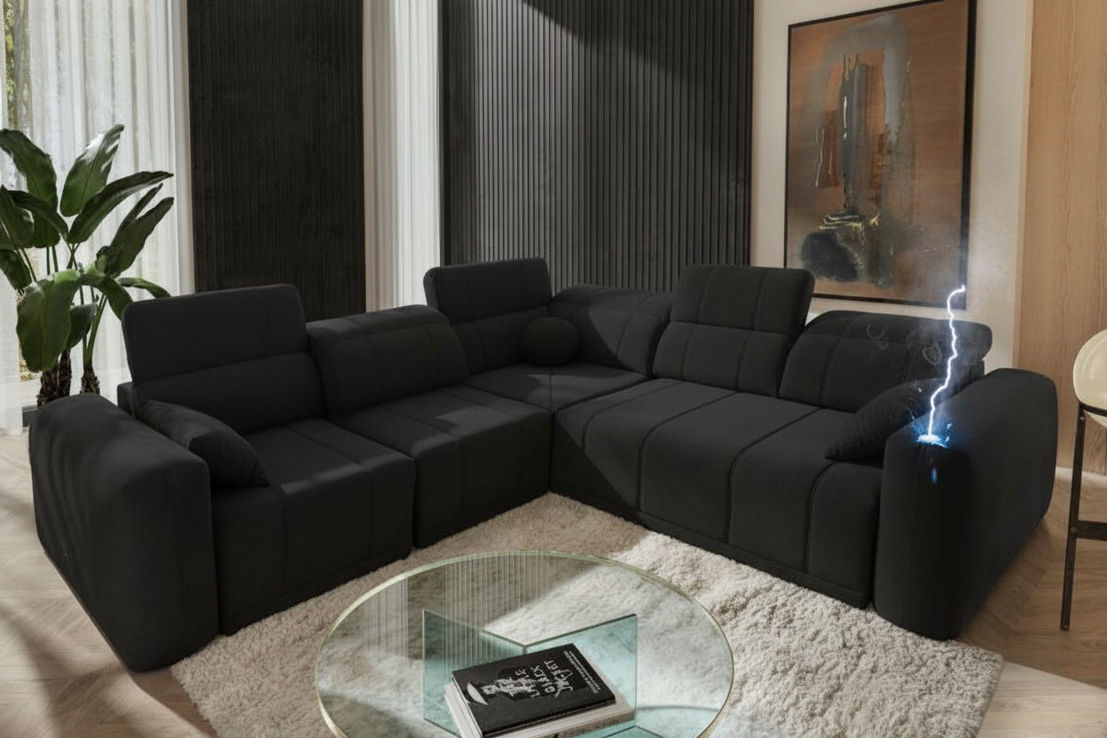 Canapé relax de couleur noire. Il est équipé de fonctions électriques.