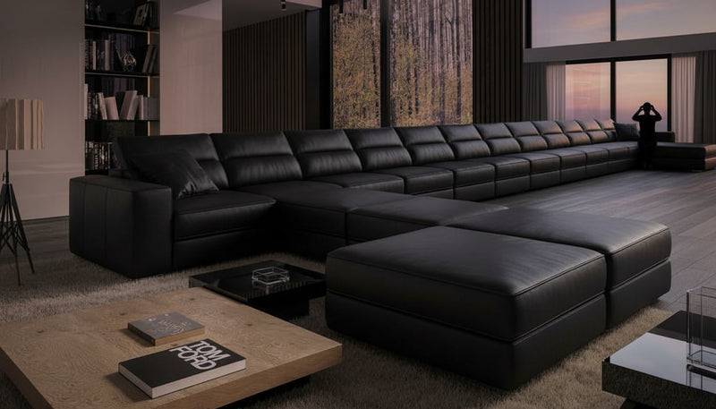Image d'un canapé de type panoramique, de couleur noire.