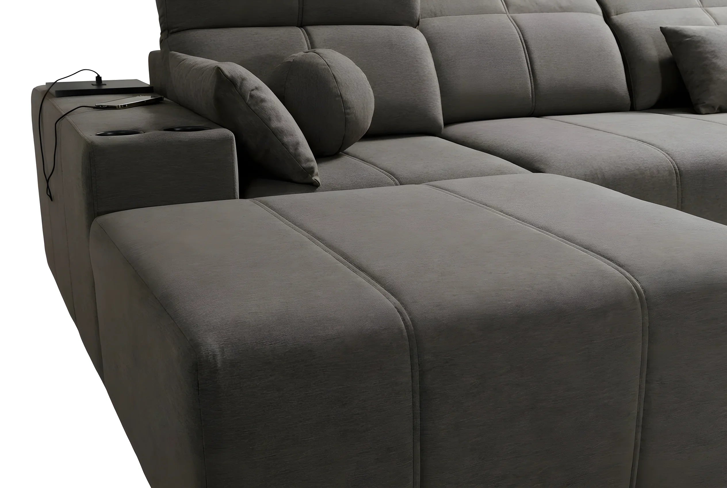 Canapé d'angle gris en tissu, design moderne avec coussins et espace recharge téléphone.